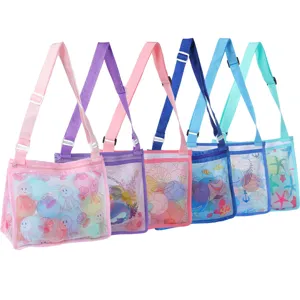 Durable kids mesh beach bag with adjustable strap for toy storage and collecting sea shells.