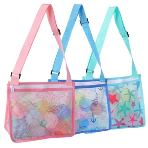 Children beach mesh bag detail showing adjustable strap, zipper closure and cute printed patterns.