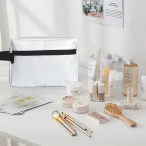 Silver PU cosmetic bag detail showing dual layer design, waterproof travel toiletry organizer.