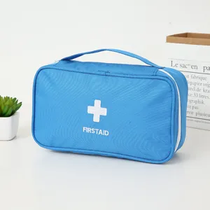 Sac de premiers secours médical bleu portable avec poignée et logo croix blanche voyage.