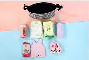 Stroller organizer bag detail view with baby accessories like diapers bottles and wet wipes.