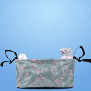 Multifunctional baby stroller organizer bag with large capacity and durable flamingo pattern.
