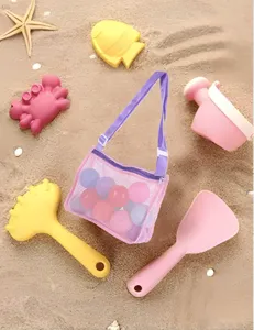 Kids beach toy mesh bag with adjustable strap and cute sand toys set for outdoor travel play.