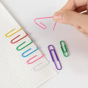 Close-up of colorful metal paper clips, ideal for office organization and cute bookmarks.