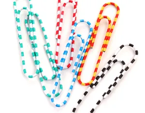 Detailed close-up shot of colorful striped paper clips, vibrant office stationery design.