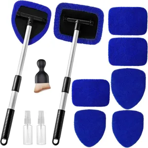 Car windshield cleaning tool detail showing extendable handle, blue microfiber pads and spray bottles.