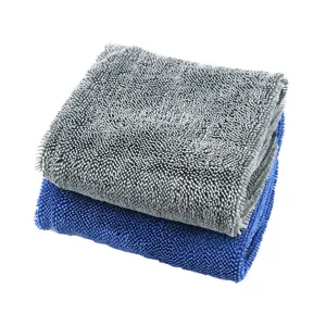 Close-up detail of the twisted microfiber drying towel, showing soft texture and thickness.