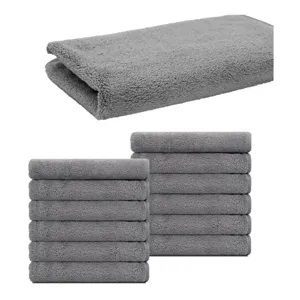Grey microfiber salon towel detail showing soft texture and folded stack for beauty care.