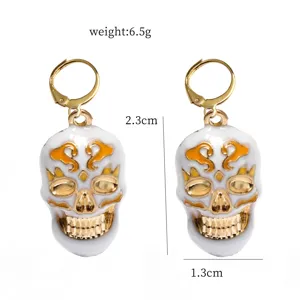 Halloween skull earrings with gold plating and white enamel, lightweight size for daily wear.
