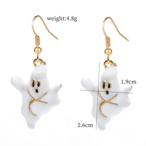 Close-up detail of cute Halloween white ghost earrings with gold hooks and stitched accents.
