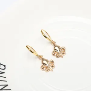 Gold-plated dangle earrings featuring delicate vintage floral pendant design, perfect for detailed look.