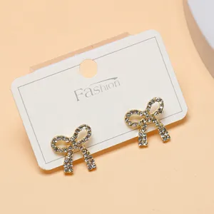 Rhinestone bow earrings for women, elegant sparkling crystal stud earrings for daily wear.