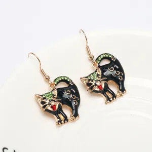 Black cat drop earrings with green rhinestones and gold hook for women fashion jewelry design.