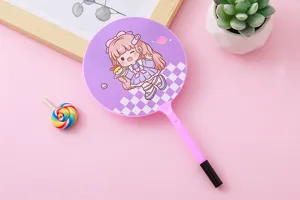 Detail view of a purple ballpoint pen with a cute cartoon girl fan-shaped topper.