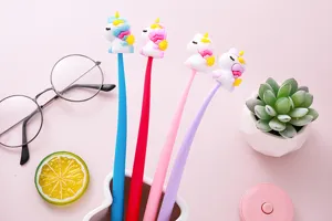 Detailed view of colorful unicorn gel pens with soft rubber toppers in a lifestyle setting