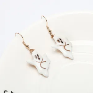 Detailed shot of white ghost earrings with gold tone hooks, perfect for Halloween styling.