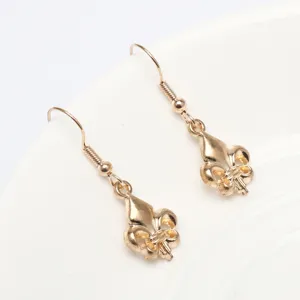 Gold-tone Fleur-de-lis dangle earrings with classic heraldic design for elegant daily wear.