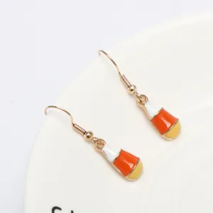 Halloween candy corn hook earrings featuring white, orange, and yellow enamel drop design.
