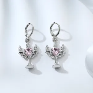 Detailed view of silver alloy pink heart crystal rhinestone candelabra character drop earrings.