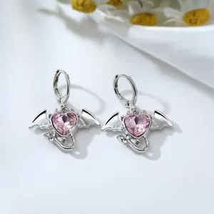 Cute pink crystal devil heart earrings with bat wings, sweet style alloy ear jewelry detail.