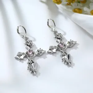 Silver cross drop earrings featuring gothic roses and a sparkling pink heart crystal detail.