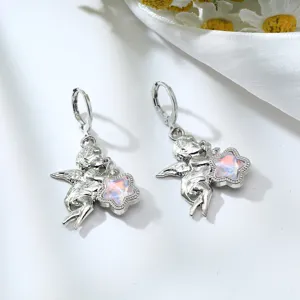 Silver-toned angel drop earrings featuring a cute pink iridescent star charm. Sweet and trendy.