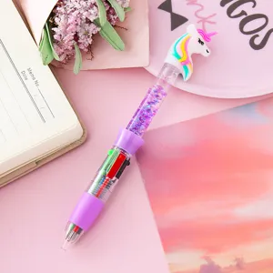 Decorative multi-color ballpoint pen with a unicorn topper and purple quicksand glitter barrel