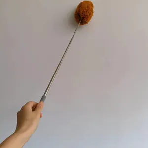 Detailed shot of the extendable stainless steel duster with a fluffy brown head for cleaning.