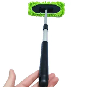 Extendable car windshield cleaning tool with green chenille microfiber head for auto interior.