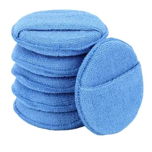 Blue microfiber car waxing sponge applicator pads stack for vehicle polishing and detailing.