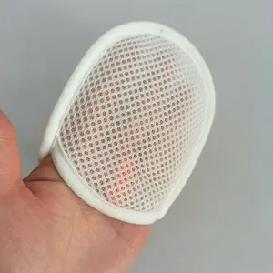 Detail closeup of white sandwich mesh soap foaming net pocket for bath and laundry.