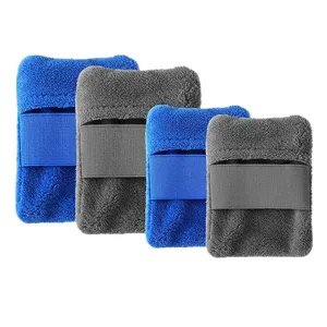 Close-up of plush beach sand removal mitts with elastic bands in blue and grey colors.