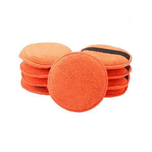 Orange microfiber car waxing sponge pads for professional auto polishing and cleaning tools.