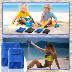 Outdoor beach sand removal mitt detail view, blue plush fabric glove for easy sand cleaning.