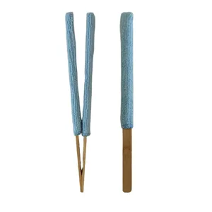 Microfiber cleaning brush detail, removable blue cloth sleeve on wooden bamboo tong for vents.