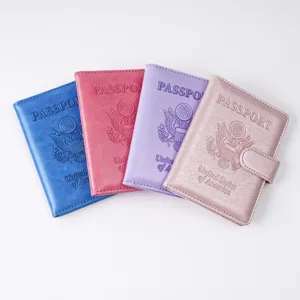 Detailed view of four colorful PU leather passport holders with snap closure and card slots.