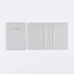 Silver PU leather passport holder with card slots and travel document sleeve design.