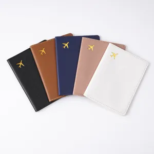 Multi-color PVC passport holder close-up showcasing neat stitching and gold airplane detail.