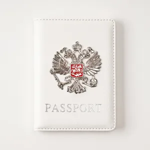 White PU leather passport cover with metal double-headed eagle badge and passport lettering.
