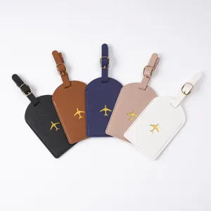 Set of 5 colorful PU leather luggage tags with gold airplane embroidery and metal buckles.