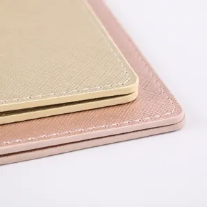 Close-up detail of PU leather passport holder with fine stitching and oil edge design.