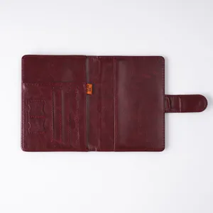 Multifunctional PU leather passport cover with RFID blocking card slots and ticket holder for travel.