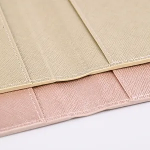 PU leather passport holder detail, fine stitching and cross-texture travel card wallet case.