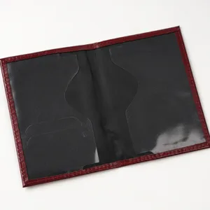 Close-up view of the internal transparent pockets and card slots of the passport cover.