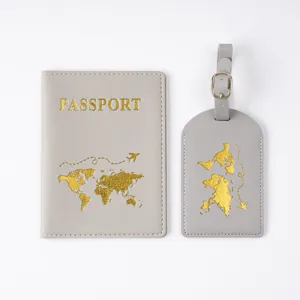 Gray PVC passport cover and luggage tag set with gold foil world map design for travel.