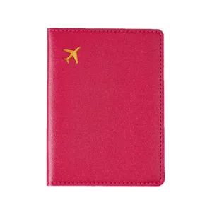 Pink passport cover with gold airplane stamp, durable PVC leather travel wallet holder.