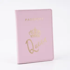 Pink PU leather passport cover with gold foil crown and Queen print for travel protection.