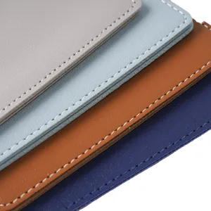 Multi-color faux leather passport cover set with neat white stitching detail, durable card holder.