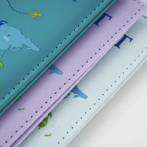 Detail shot of colorful world map passport holder travel wallet, premium PU leather cover.