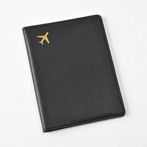 Black PU leather passport holder with gold airplane accent, minimalist travel wallet cover.